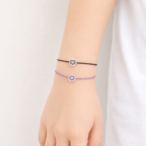 Bracelet enfant Cœur Lumineux Celina Minia en acier inoxydable avec cœur phosphorescent et cordon ajustable.