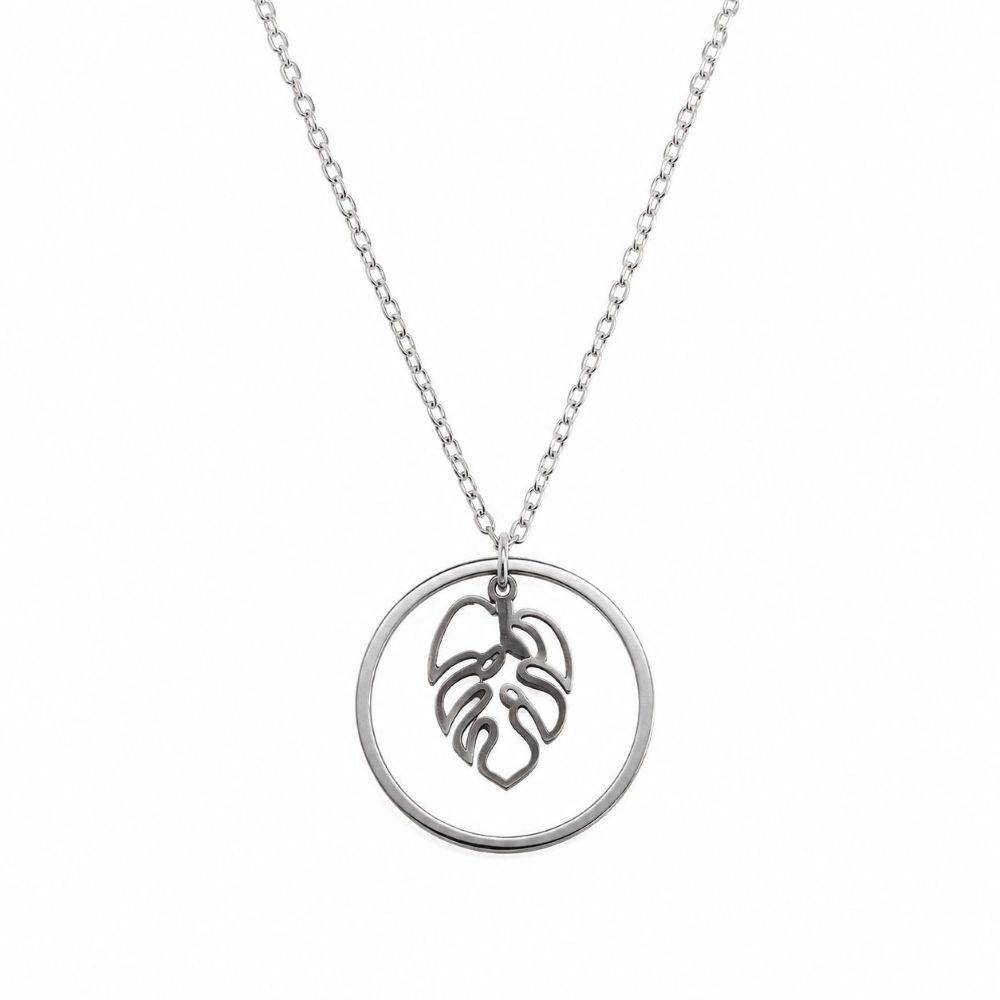 Collier Mila en acier inoxydable argenté avec pendentif feuille Monstera dans un cercle.