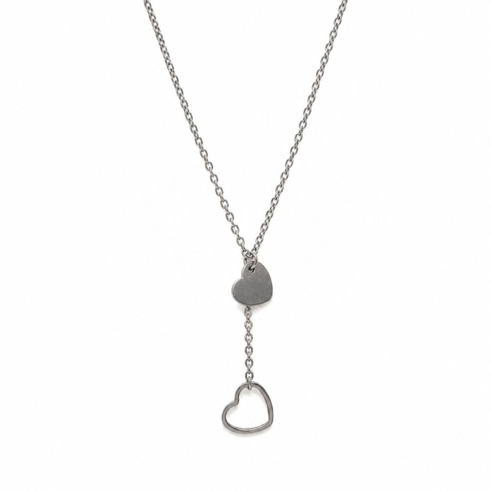 Collier Cécilia en acier inoxydable argenté avec deux pendentifs cœur et chaîne ajustable.