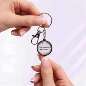 Porte-clé « Puéricultrice Formidable » avec cabochon en verre argenté.
